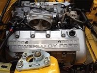 Yellow car coil cover